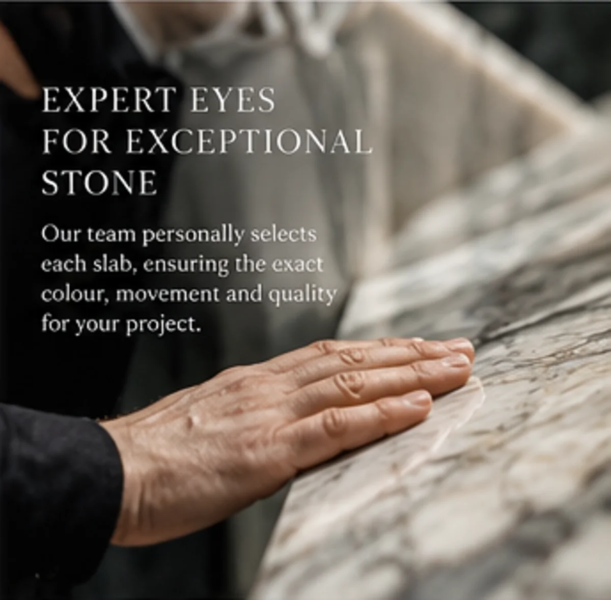 Tenetti specialist inspecting the veining and surface of a marble slab by hand